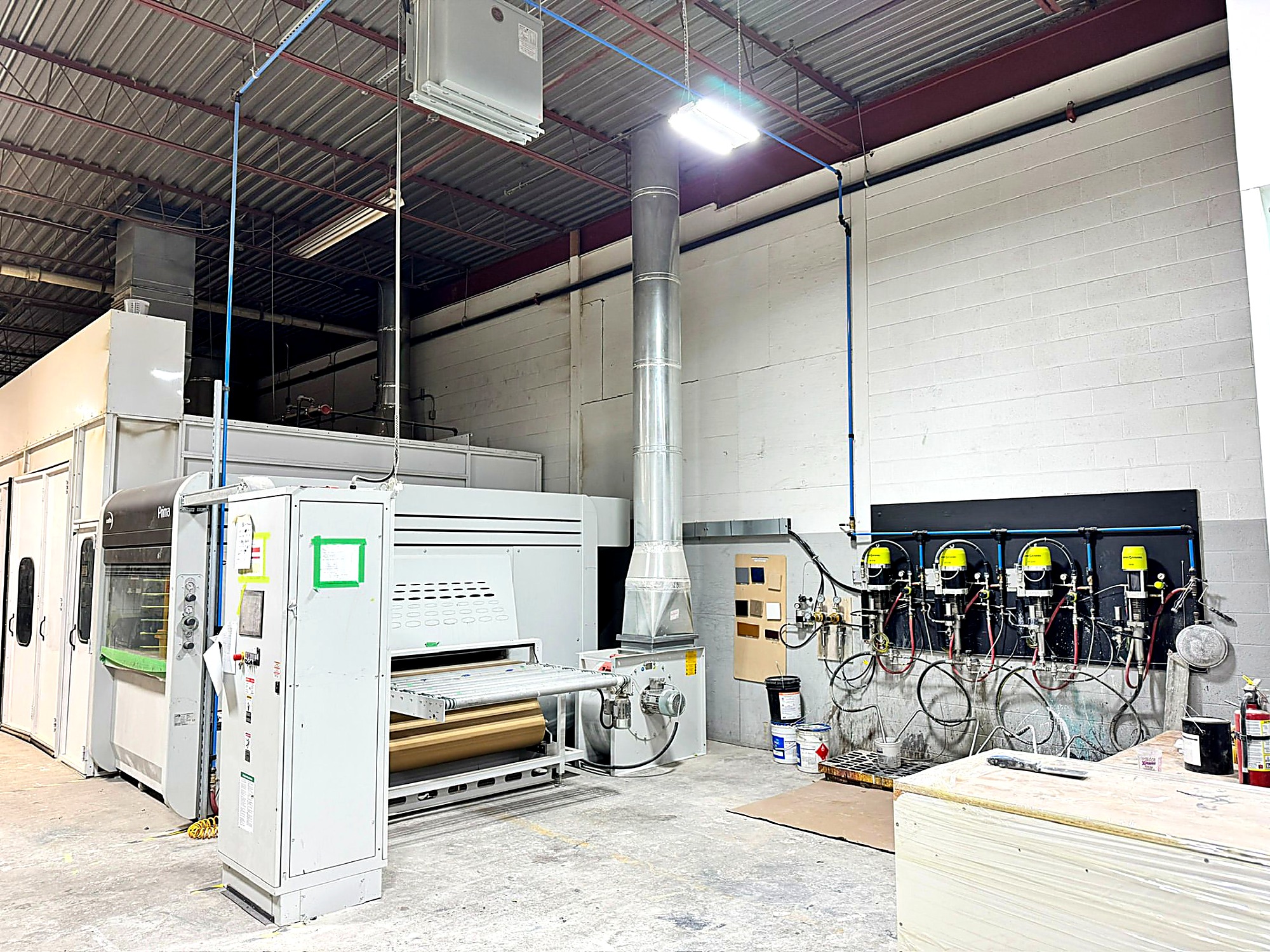 Sandha Woodworks’ in-house finishing equipment on the production floor in Brantford, Ontario